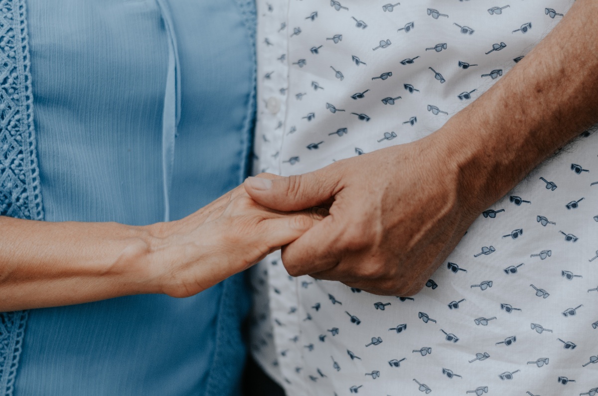 Two people holding hands 